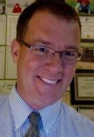 Drummer Tim Kane during his news executive shirt and tie days.